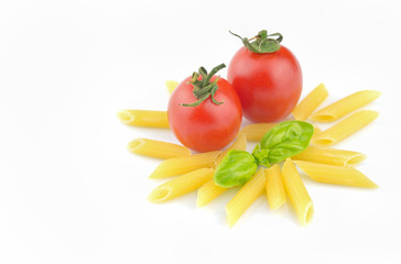 Pasta, fresh tomatoes and basil on white background