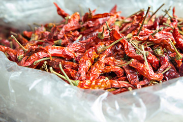 Dried red hot chillies in plastic bag