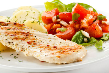Grilled chicken fillet, boiled potatoes and vegetable salad 