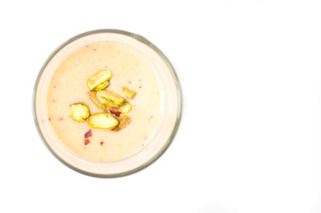 Fruit smoothie topped with pistachio nuts