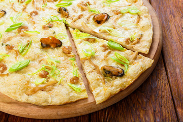 Delicious seafood pizza with olives
