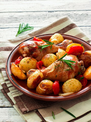 Oven-baked chicken drumsticks and potatoes