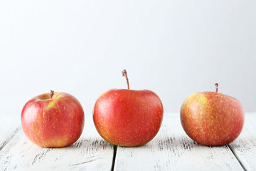 Apples on white wooden background