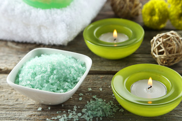 Sea salt in white bowl with candles