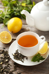 Green tea in cup and teapot 