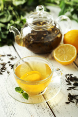 Green tea in cup and teapot 