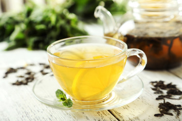 Green tea in cup and teapot 