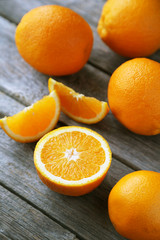 Orange juice in bottle and orange in basket 