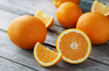 Orange juice in bottle and orange in basket 