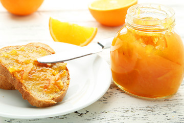Orange juice in bottle and orange in basket 