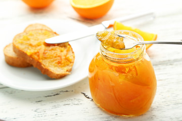 Orange juice in bottle and orange in basket 