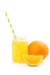 Glass of fresh orange juice on wooden background