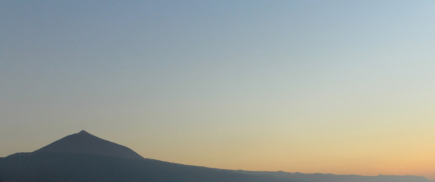 mountain silhouette panorama with clear sky sunset