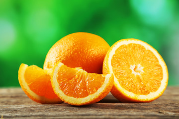 Fresh orange fruit on grey wooden background