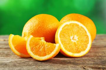 Fresh orange fruit on grey wooden background