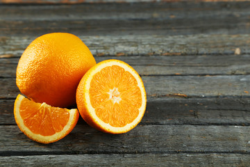 Fresh orange fruit on wooden background