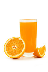 Glass of fresh orange juice on wooden background