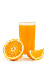 Glass of fresh orange juice on wooden background