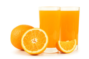Glass of fresh orange juice on wooden background