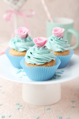 Tasty cupcake on pink background