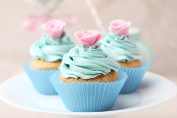 Tasty cupcake on pink background