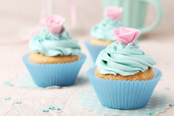 Tasty cupcake on pink background