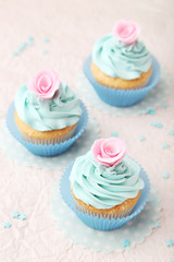 Tasty cupcake on pink background