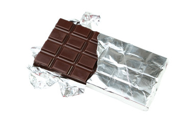 Dark chocolate bar in foil isolated on white