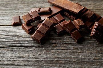 Chocolate plates on grey wooden background