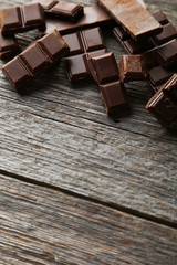 Chocolate plates on grey wooden background