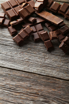 Chocolate plates on grey wooden background
