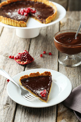 Homemade chocolate tart with pomegranate 