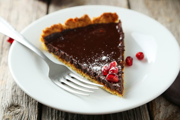 Homemade chocolate tart with pomegranate 