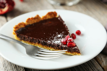 Homemade chocolate tart with pomegranate 