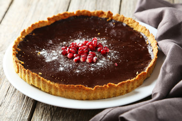 Homemade chocolate tart with pomegranate 