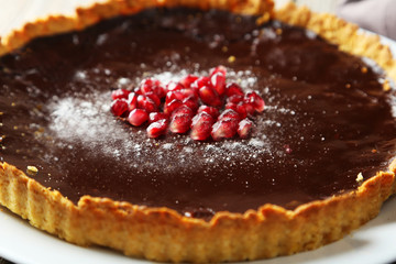 Homemade chocolate tart with pomegranate 