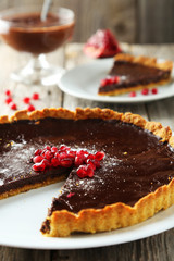 Homemade chocolate tart with pomegranate 