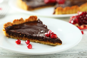 Homemade chocolate tart with pomegranate 