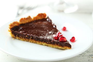 Homemade chocolate tart with pomegranate 