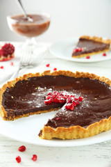 Homemade chocolate tart with pomegranate 