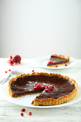 Homemade chocolate tart with pomegranate 