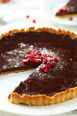 Homemade chocolate tart with pomegranate 