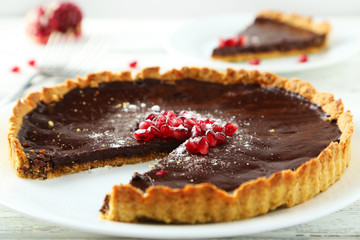 Homemade chocolate tart with pomegranate 