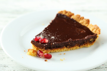 Homemade chocolate tart with pomegranate 