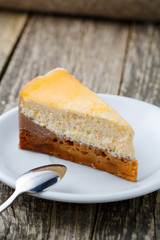 Sweet slice of carrot cake on white plate.