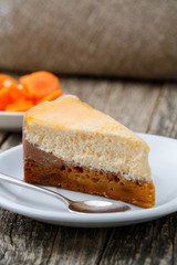 Sweet slice of carrot cake on white plate.