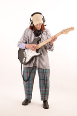 Naklejka premium Funny elderly lady playing electric guitar.