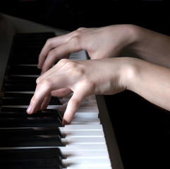 Fototapeta premium Hands of teenager playing synthesizer