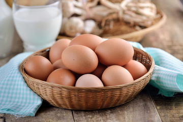 Easter egg in a basket on wodden table