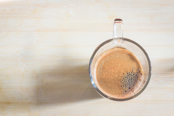 cup of fresh espresso on table, view from above
